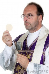 priest-holding-wine-and-bread
