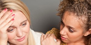 Woman consoling friend