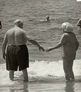 old people holding hands
